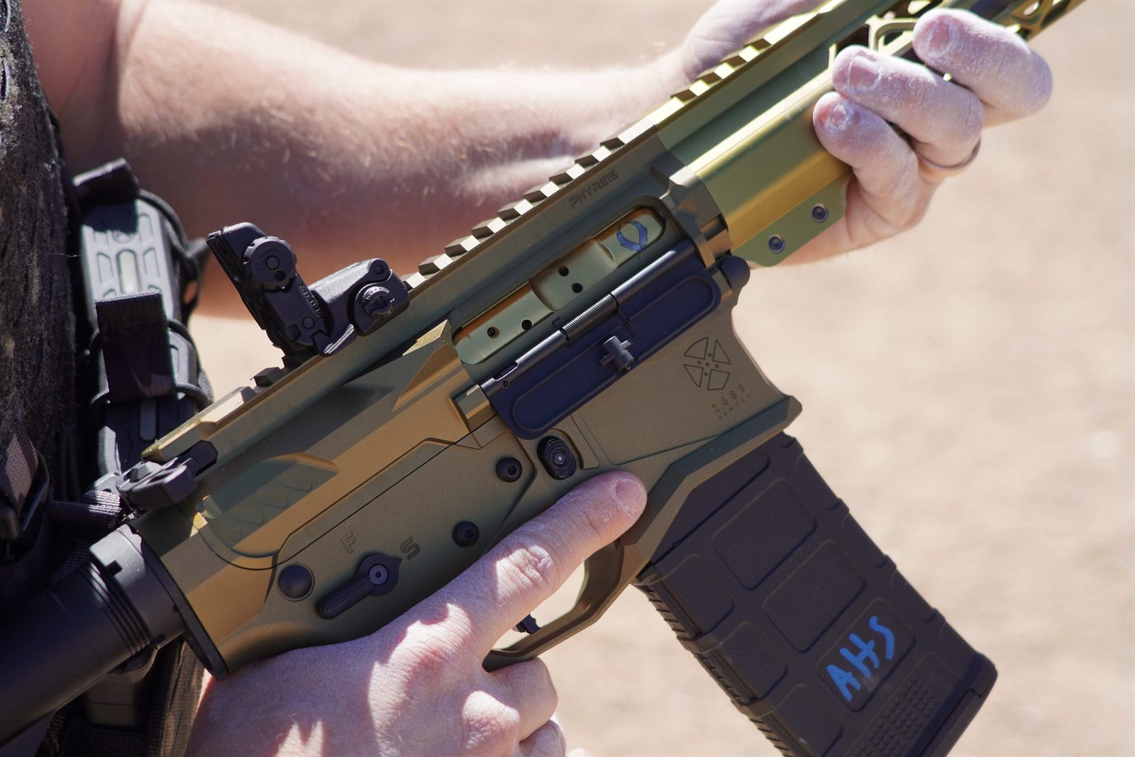 Close-up of the PHYRE15 receiver and gold bolt carrier
